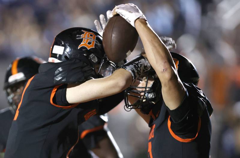 DeKalb's Ethan Tierney celebrates his touchdown catch with Cooper Phelps during their game against Metea Valley Friday, Sept. 16, 2022, at DeKalb High School.