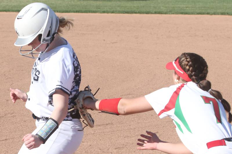 Kaneland's Isabelle Stombres is tagged out by L-P's Callie Mertes while trying to get back to the bag on Wednesday, April 2024 at the L-P Athletic Complex in La Salle.