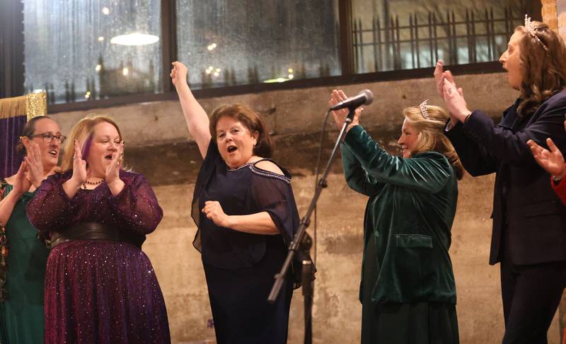 Julia Messina, NCI Artworks Executive Director, (center) reacts after being crowned “Queen of the Arts” during the 9th annual NCI Artworks Mad Hatter Ball on Friday, Jan. 16, 2026 at the Westclox Event Center in Peru.