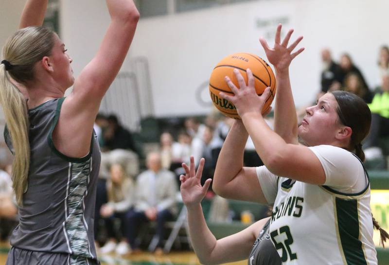 St. Bede's Ava Balestri runs in the lane to eye the hoop as Midland's Anna McGlasson defends on Thursday, Dec. 4, 2025 at St. Bede Academy.