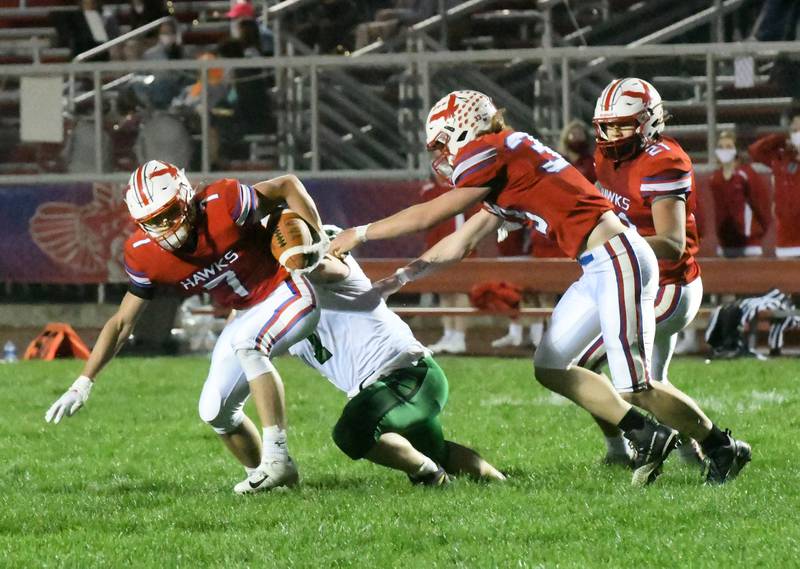 Oregon's Andrew Herbst escapes from a North Boone tackler at Landers Loomis Field.