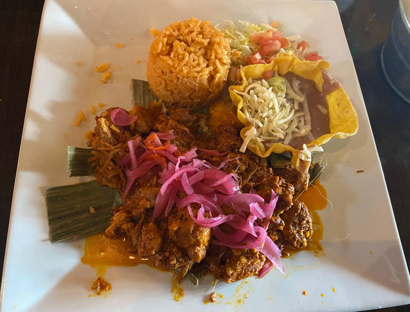 I ordered cochinita pibil, Yucatan-style pulled pork topped with habanero purple onion, served with rice and beans, at Antigua Mexican Brunch and Grill in Algonquin.