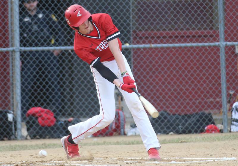 Streator's Joe Hoekstra strikes out while chasing a ball down low against Hall on Tuesday, March 18, 2025 in Foley Field at Kirby Park in Spring Valley.