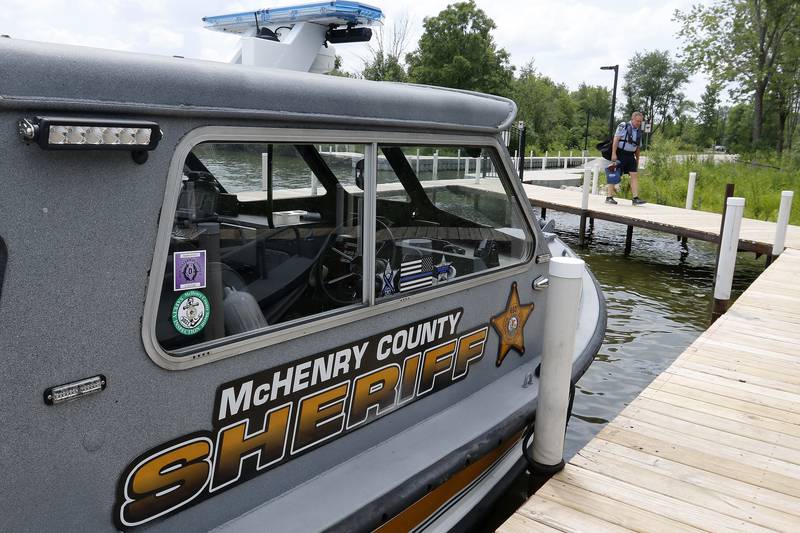 McHenry County Sheriffs Office Marine Unit Deputy John Szatkowski heads to his boat to monitor boaters on the Fox River and Chain O' Lakes on Tuesday, July 6, 2021.