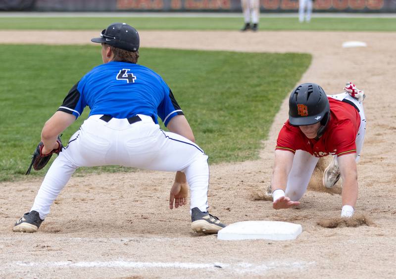 Batavia’s Keegan Harp slides into first during the Class 4A Regional semifinal against St. Charles North at Batavia High School in Batavia on Thursday, May 29, 2025.