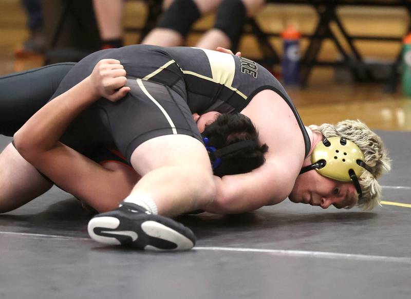 Sycamore’s Adam Carrick pins Kaneland’s George Slepicka during their 190 pound match Thursday, Jan. 9, 2025, at Sycamore High School.