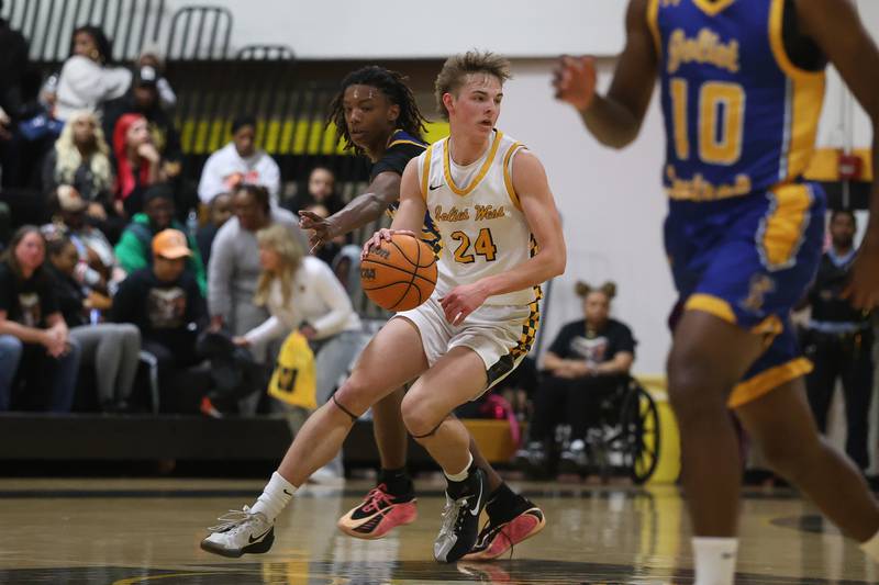 Joliet West’s Ryan Lipke looks for a play midcourt against Joliet Central on Tuesday, Feb. 17, 2026 in Joliet.