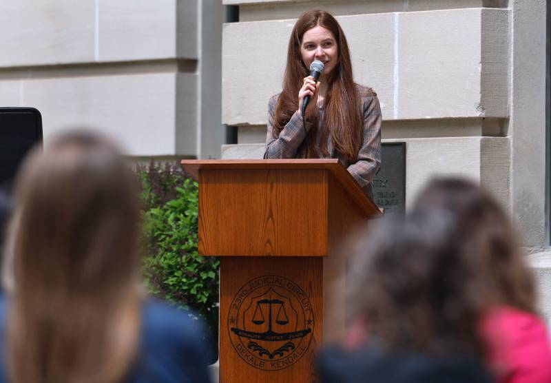 Jessica Sandlund, executive director of CASA DeKalb County, speaks Wednesday, April 29, 2026, during Hands Around the Courthouse at the courthouse in Sycamore. The event was held to mark Child Abuse Prevention Month.