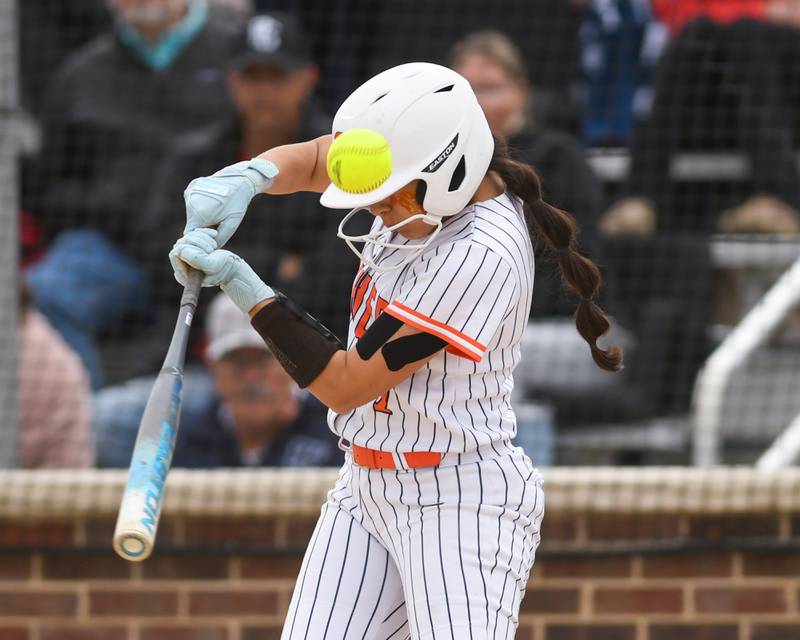 Oswego's Ellalina Mahoney (7) makes contact with the ball for a base hit during the regional final game against Benet Academy on Friday May 22, 2026, where the game was played at Oswego High School.