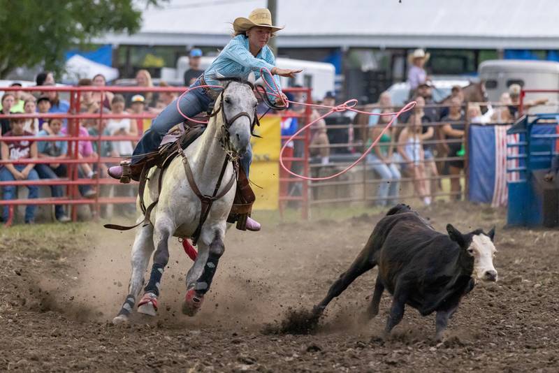 Cowgirl Randy Walther tosses her lasso at the calf in the breakaway roping competition during the LaSalle County 4H Fair rodeo on July 11, 2025 in Ottawa.