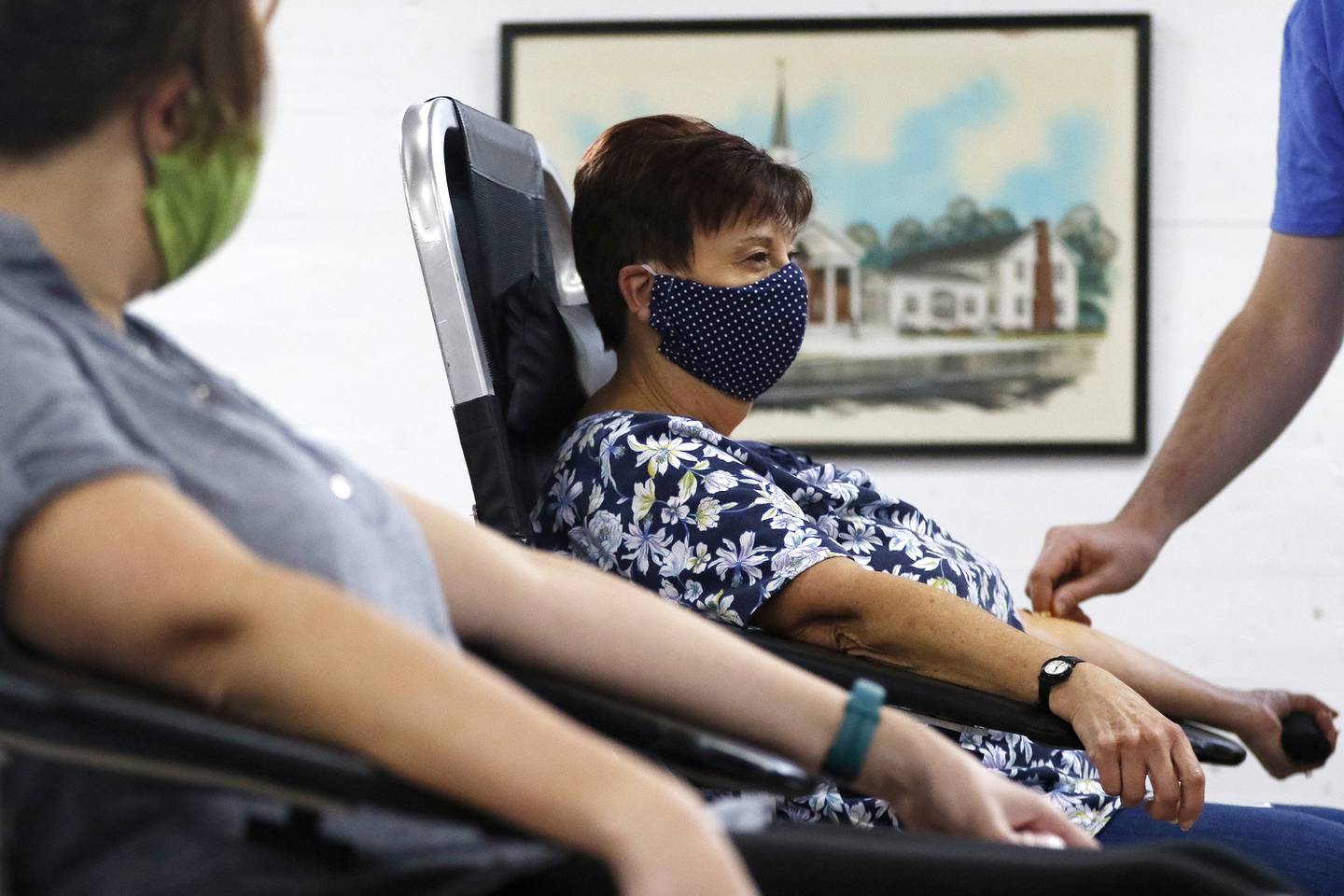 Taryn Kraemer, of Wonder Lake, left, and her mother, Nanette Colwell, of McHenry, center, prepare to have a donation of blood drawn by phelotomist Stephen Buhrt, right, during a Versiti blood drive on Saturday, Nov. 20, 2021 at St. Joseph's Catholic Church in Richmond. A shortage in the blood supply has again resurged and blood drives are hopeful for donors.