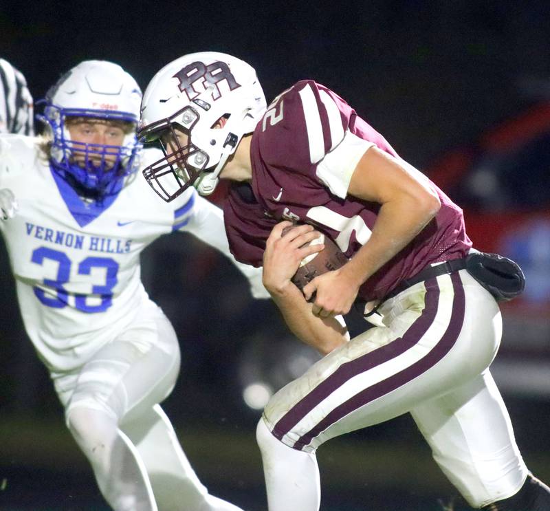 Prairie Ridge’s Vincent Byk runs the ball against Vernon Hills in IHSA football Class 5A first-round playoff action at Prairie Ridge High School in Crystal Lake on Friday, October 31, 2025.