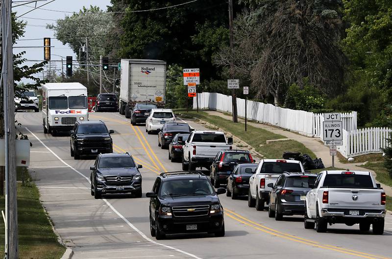 Traffic backs up Wednesday, July 19, 2023, on U.S. Route 12 at the intersection of Illinois 173 as Richmond residents and businesses prepare for more traffic and customers as the annual County Thunder Music Festival kicks off on Thursday in Twin Lakes, Wisconsin.