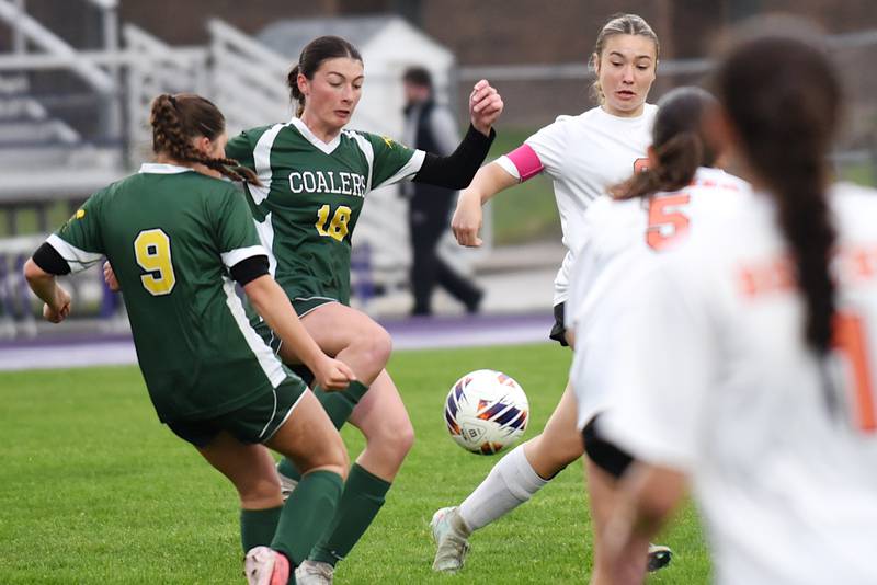 Coal City's Ava Meyer (18) is the first out of a group to get to a loose ball during the Class 1A Manteno Regional championship against Beecher Tuesday, May 20, 2025.