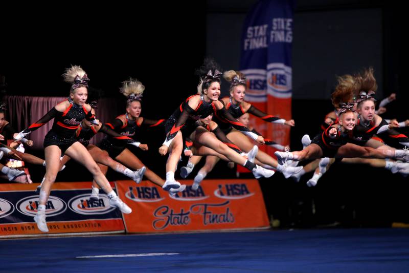 Members of the Minooka cheerleading team compete in the large team division of the IHSA State Finals on Saturday, Feb. 8, 2025 at Grossinger Motors Arena in Bloomington.