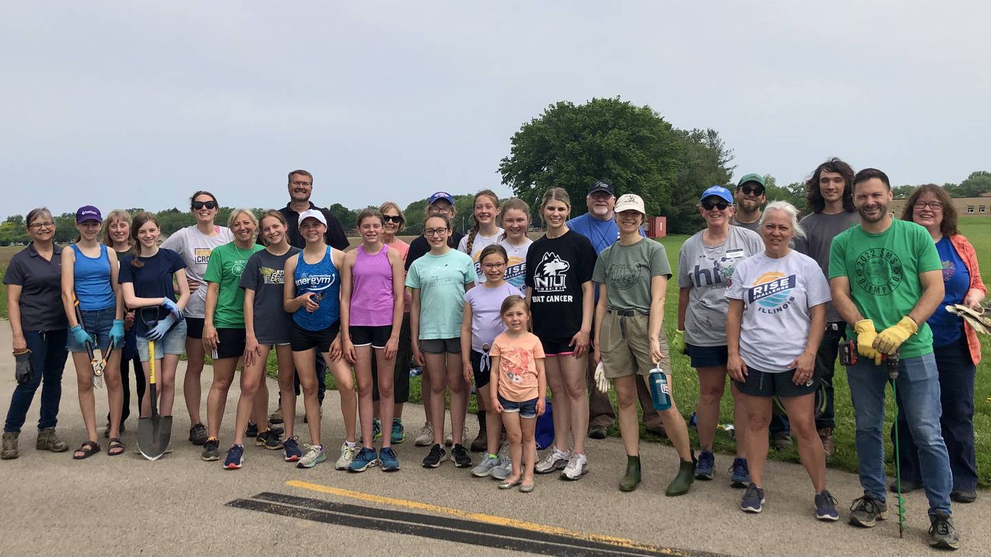 Members of G-Force Club, with local volunteers and members of school staff, planted over 600 plants on the south side of Sycamore middle school grounds to improve water retention Tues. May 31.