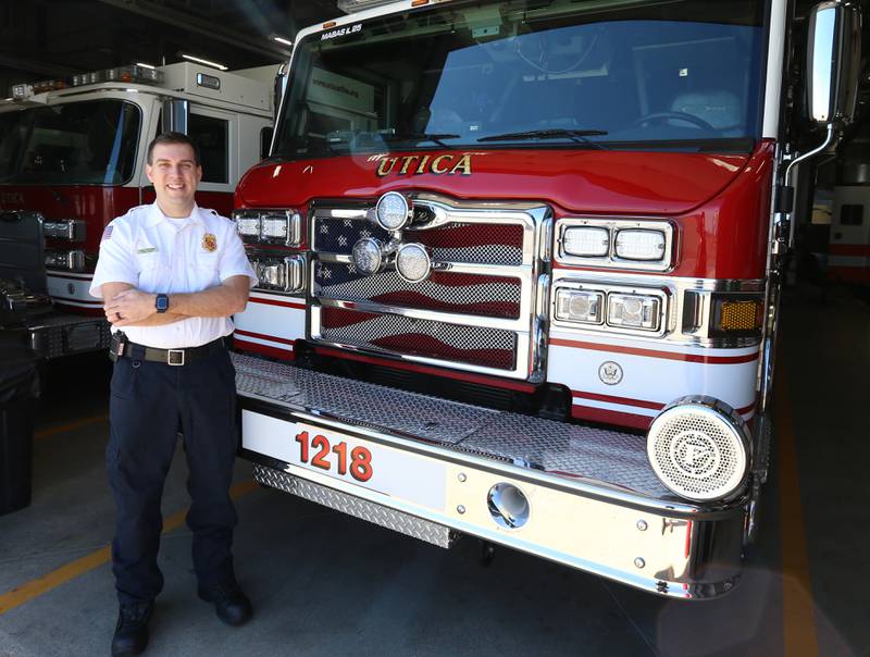 Utica Fire Chief Ben Brown, poses for a photo in front of a new fire truck on Thursday, March 14, 2024 at the Utica Fire Station.