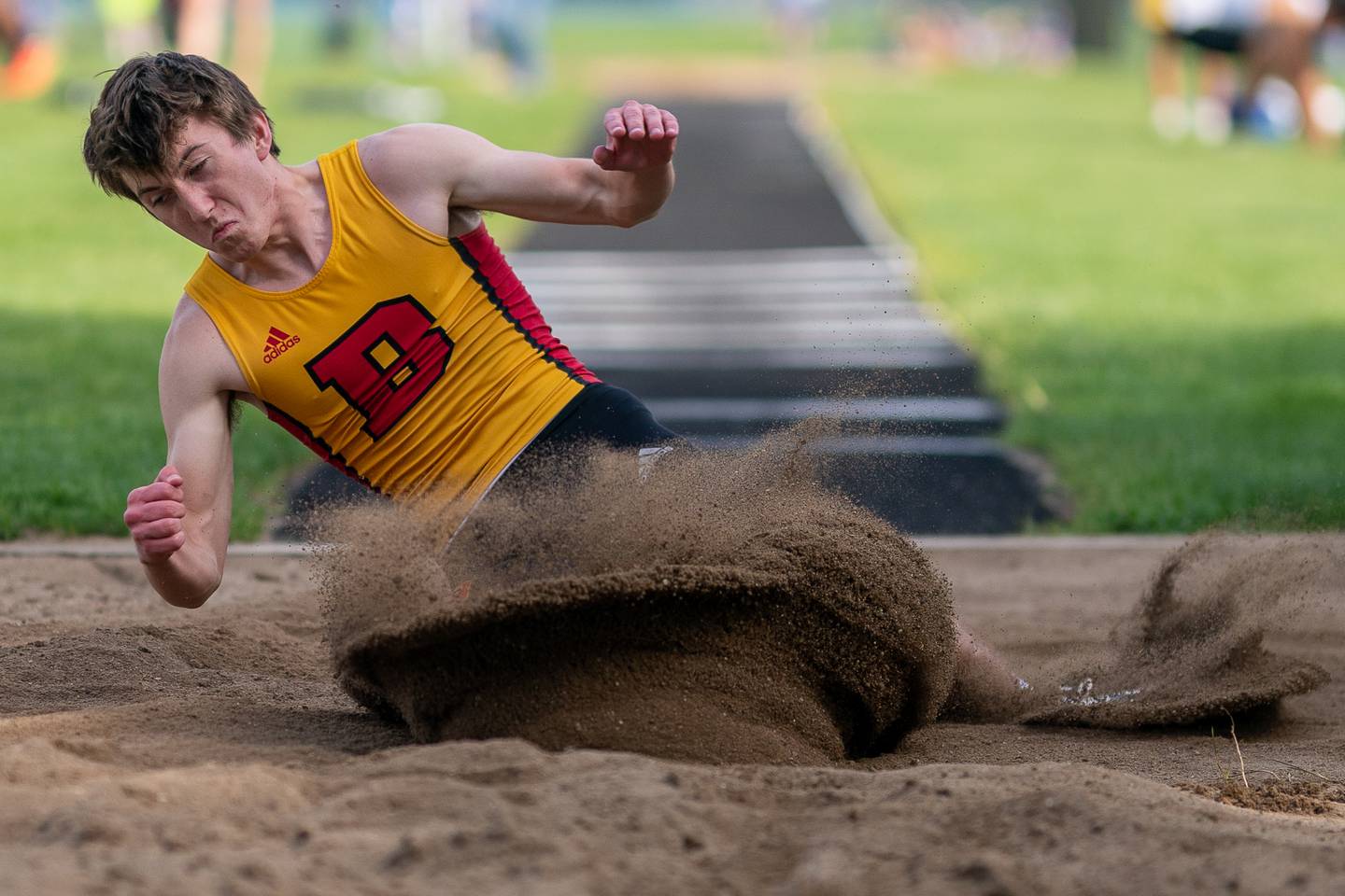 Batavia’s Ryan Wirsing competes in the long jump during a DuKane Conference boys track and field meet at Geneva High School on Thursday, May 11, 2023.