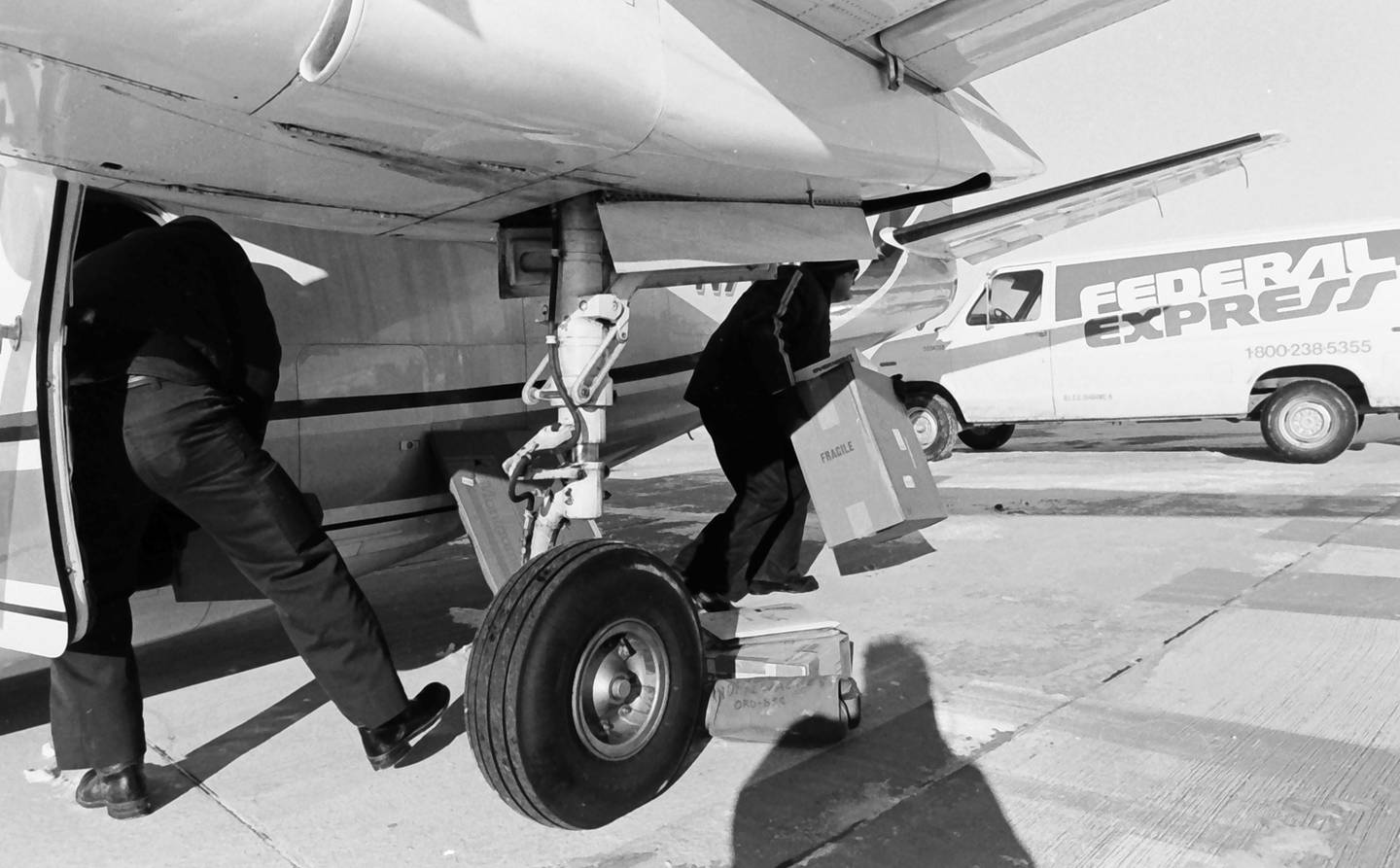 Federal Express (FedEx) employees brave bitter cold winds to unload 2,500 pounds of cargo at the Illinois Valley Regional Airport on Wednesday, Dec. 19, 1985. The Federal Express delivery marked the first major delivery by a commercial airline at the Illinois Valley Regional Airport. The company announced Monday that the facility will permanently close FedEx ship center on Sept. 27, 2025 at 3708 Progress Blvd in Peru.