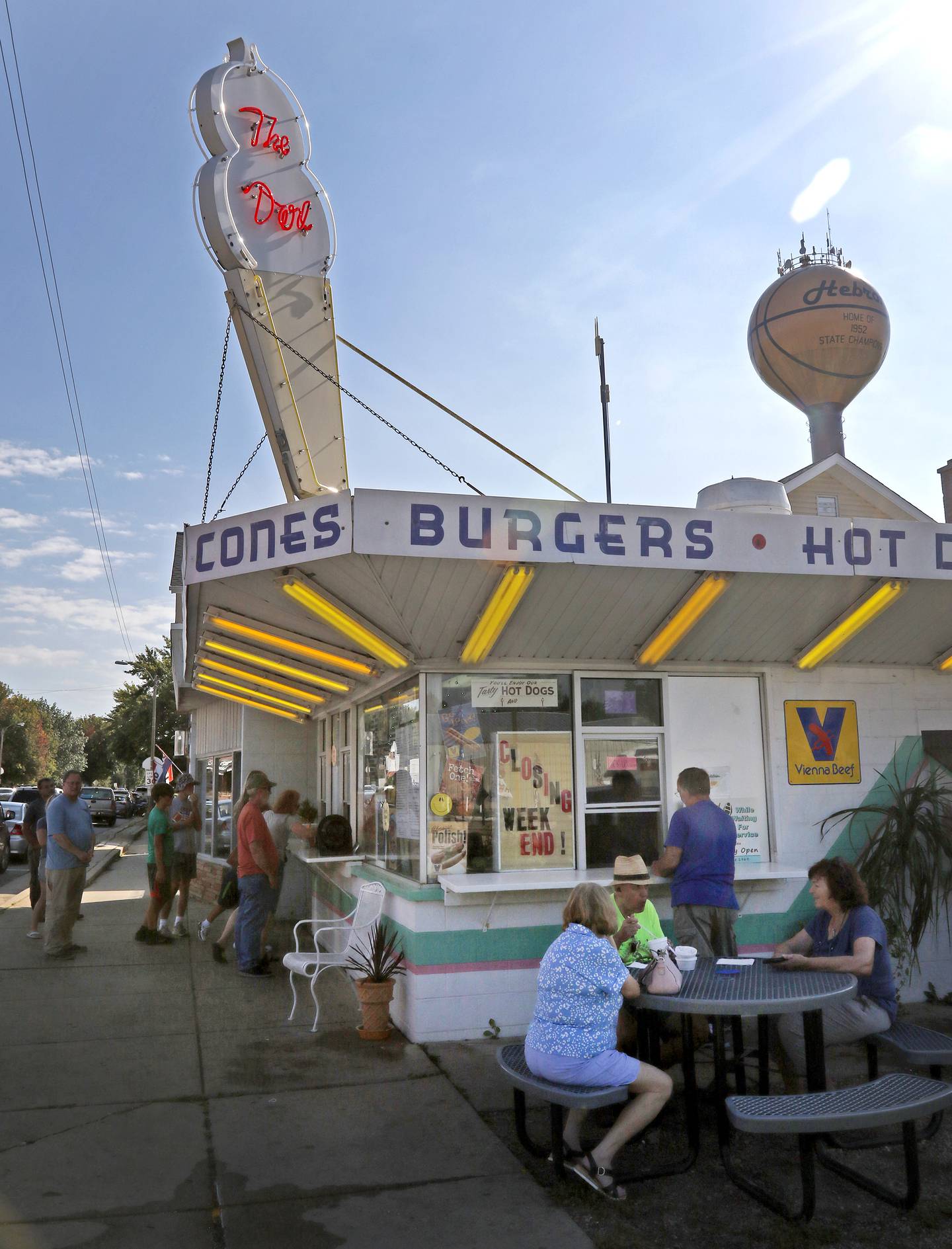People line up outside the Dari in Hebron Sunday, Sept. 18, 2022, to get food and ice cream. The Hebron landmark, that has been in operation for 53 years, is closing and up for sale. Sunday was their last day of operation.
