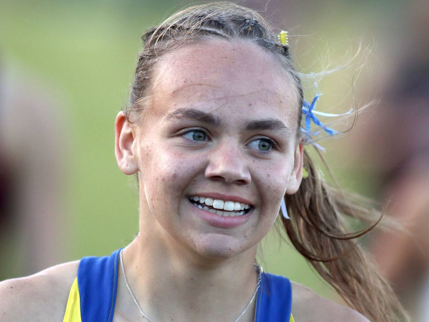 Hope Klosowicz is all smiles after a win in the 400 meters in IHSA Class 2A Girls Sectional Track action at Genoa-Kingston School in Genoa on Friday, May 16, 2025.