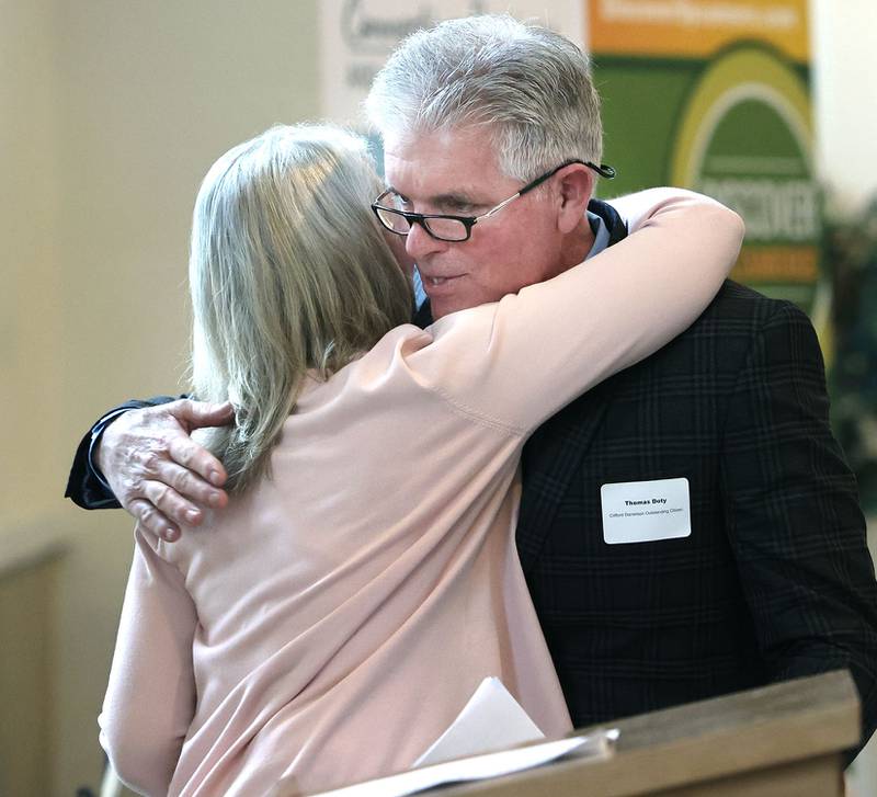 Sycamore Chamber of Commerce Clifford Danielson Outstanding Citizen Award winner Thomas Doty, of Doty & Sons, gets a hug from past winner Kathy Countryman after she introduced him during the 106th Annual Chamber Meeting Thursday, March 2, 2023, in Memorial Hall at St. Mary's Catholic Church in Sycamore.