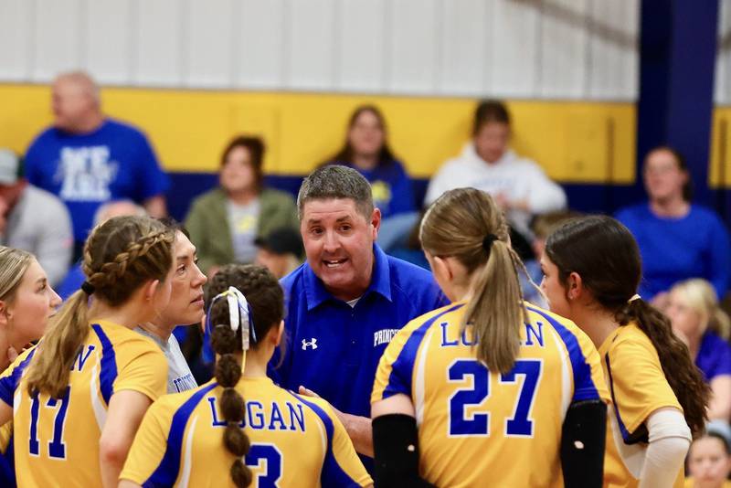 Princeton Logan coach Andy Pucks works the huddle during a timeout in Monday's Class 3A 8th grade sectional finals at Pannebaker Gym. The Lions fell in three sets to Morris Saratoga.