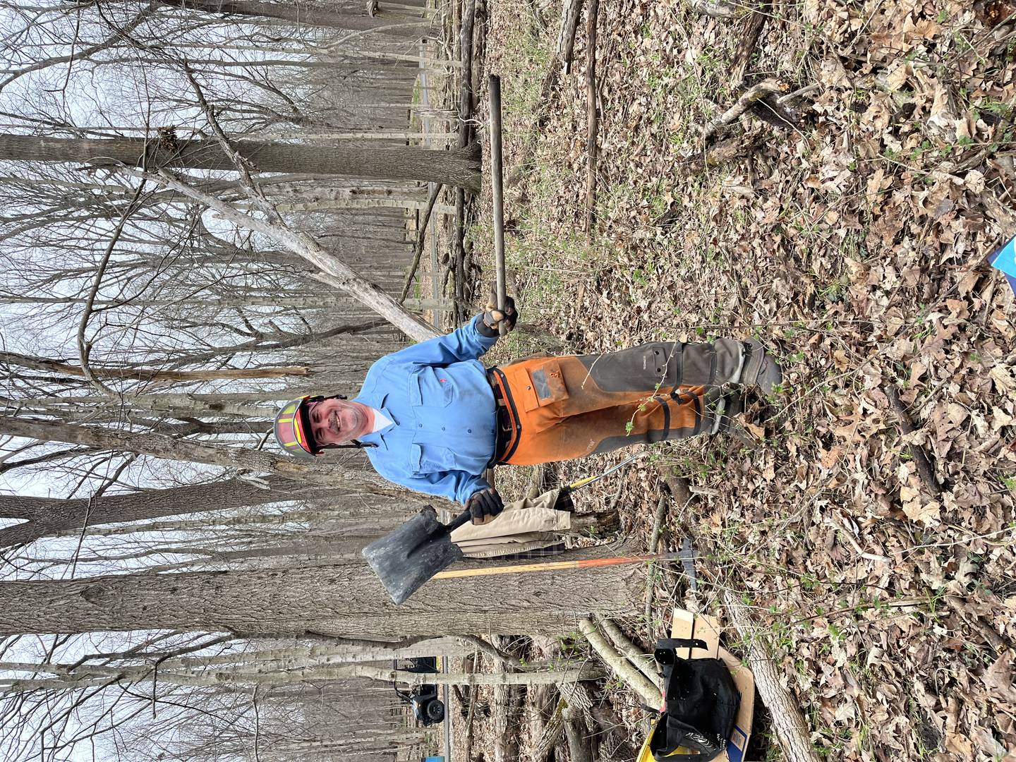 Scott Mortenson wields a shovel working to clear invasive plants from a Will County Forest Preserve.