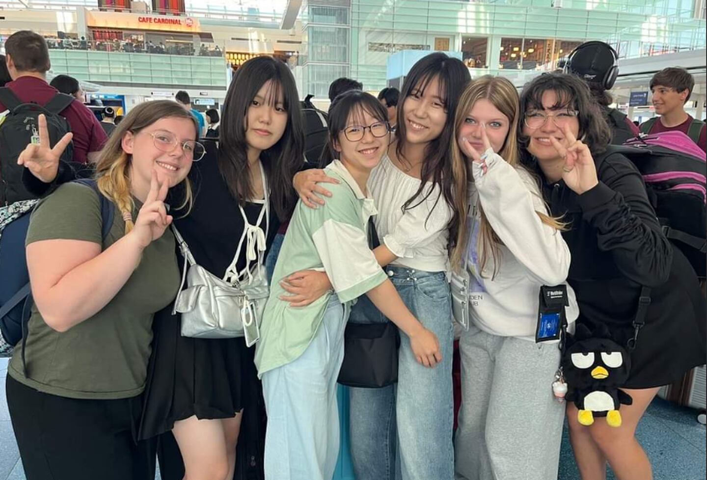 Lockport Township High School and Yamate Gakuin School students embrace at the airport.