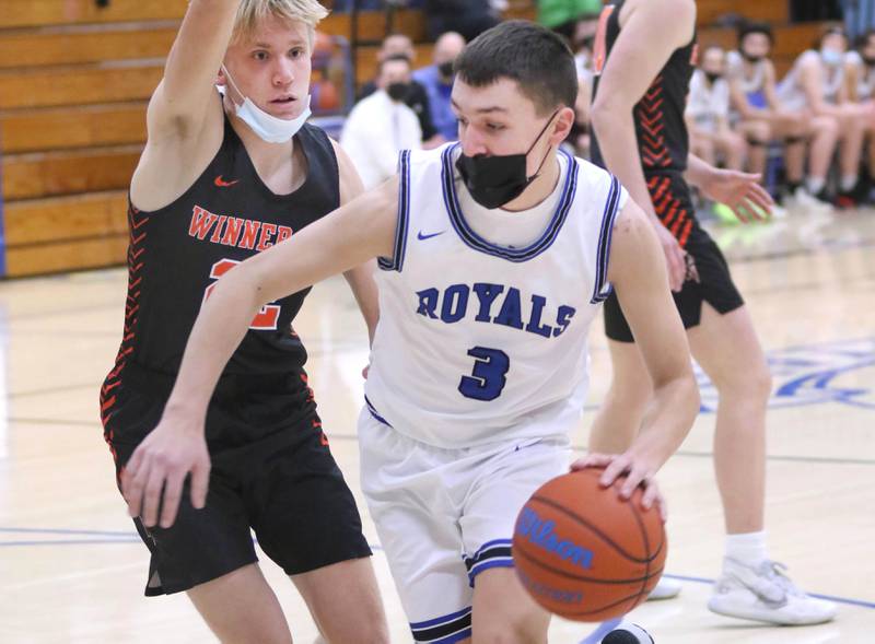 Hinckley-Big Rock's Ben Hintzsche drives around a Winnebago defender during their game Tuesday, Jan. 25, 2022, at Hinckley-Big Rock High School.