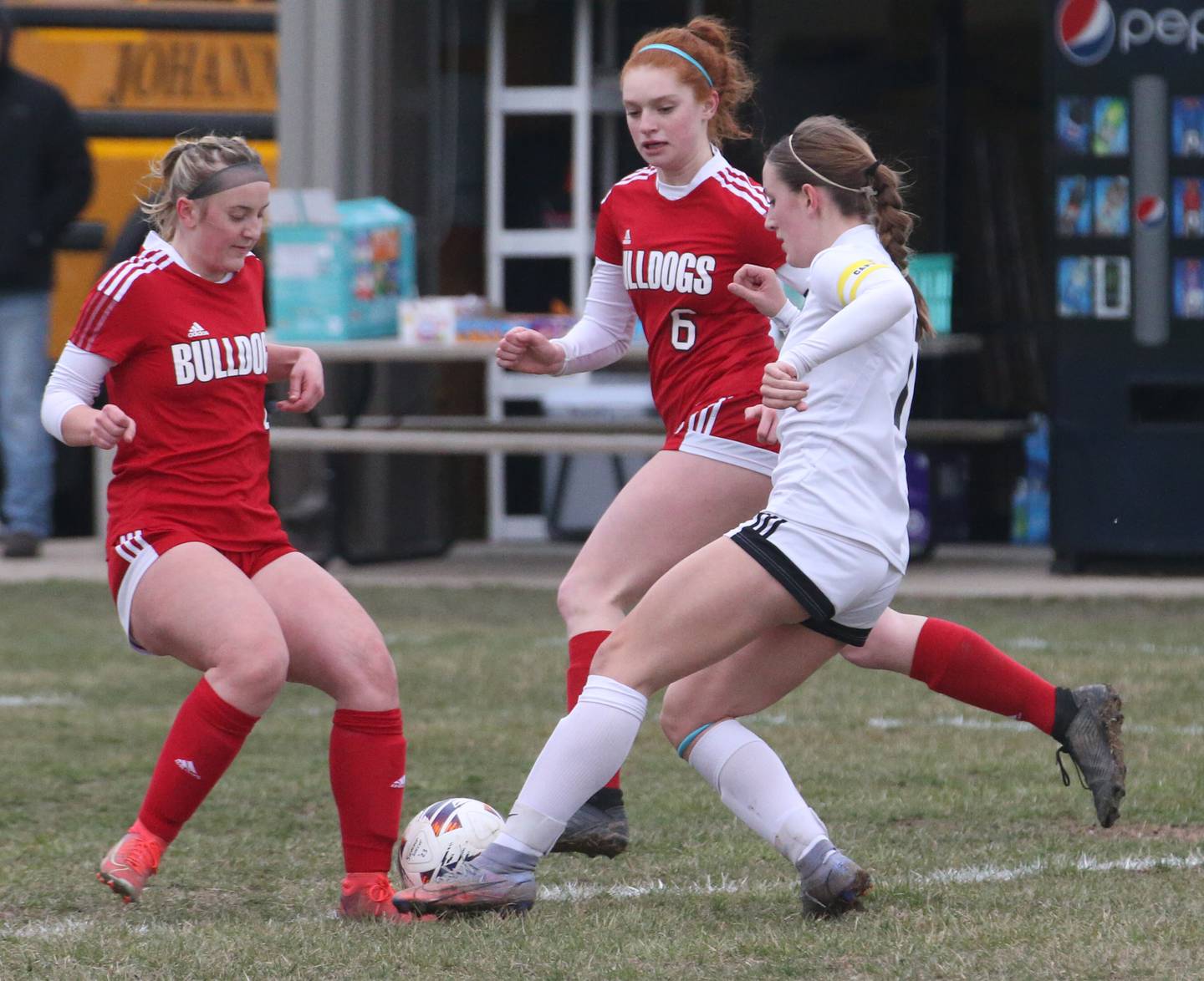 Streator's Josie Goerne (4) with the help of teammate Ellie Isermann (6) block a kick from L-P's Danica Scoma (11) on Friday, March 24, 2023, in Streator.