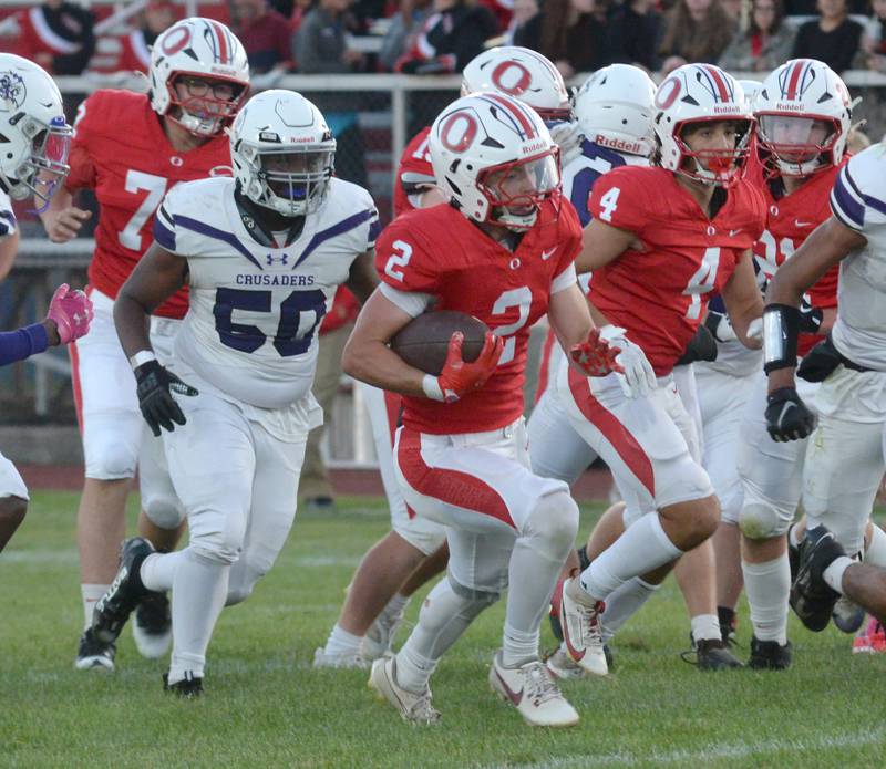Oregon's Cooper Johnson (2) runs for a gain against Rockford Lutheran on Friday, Sept. 5, 2025 at Landers-Loomis Field in Oregon. The Hawks beat the Crusaders 40-8.