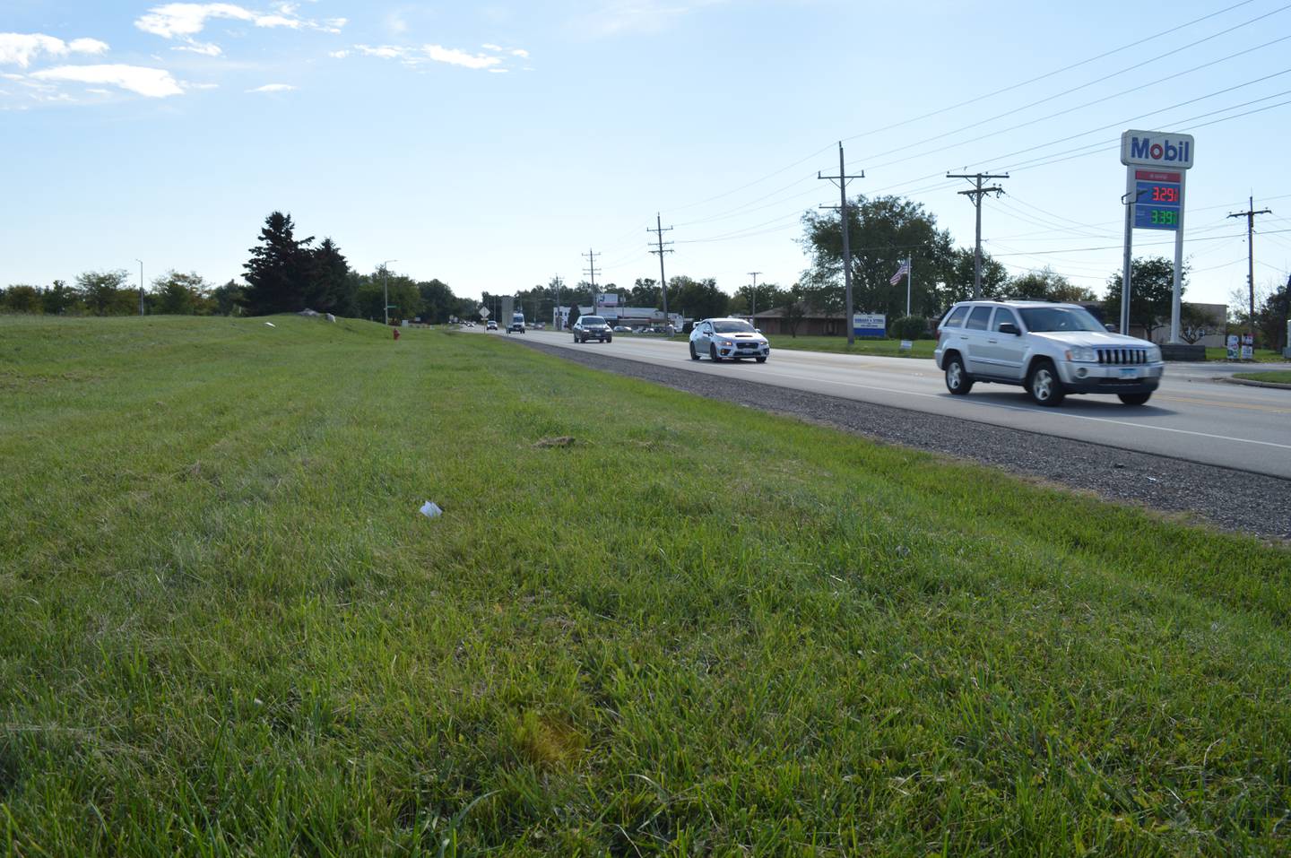 Vehicles move along Route 31 in McHenry past an empty parcel east of the highway at Veteran's Parkway that is being targeted by Cunat Inc. for the development of 540 apartment units, which would make the property McHenry's largest multi-family complex.