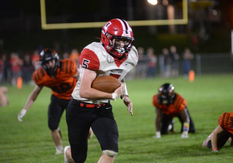 Amboy's Landon Whelchel (5) races up the sideline en route to a touchdown against Milledgeville on Friday, Sept. 29, 2023 at Milledgeville High School.
