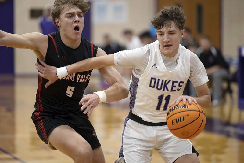 Dixon’s Brody Nicklaus works the ball against Stillman Valley’s Ryan Spangler Friday, Jan. 9, 2026.