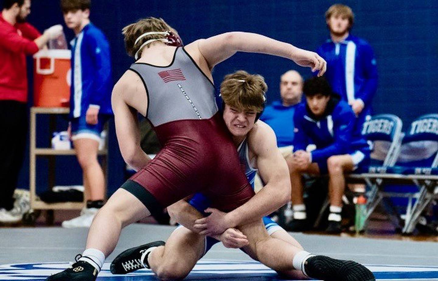 Princeton's Casey Etheridge works on making a fall against Rockridge’s Levi Junis on Friday night. He won both matches by fall as the TIgers clinched the Three Rivers Conference championship.