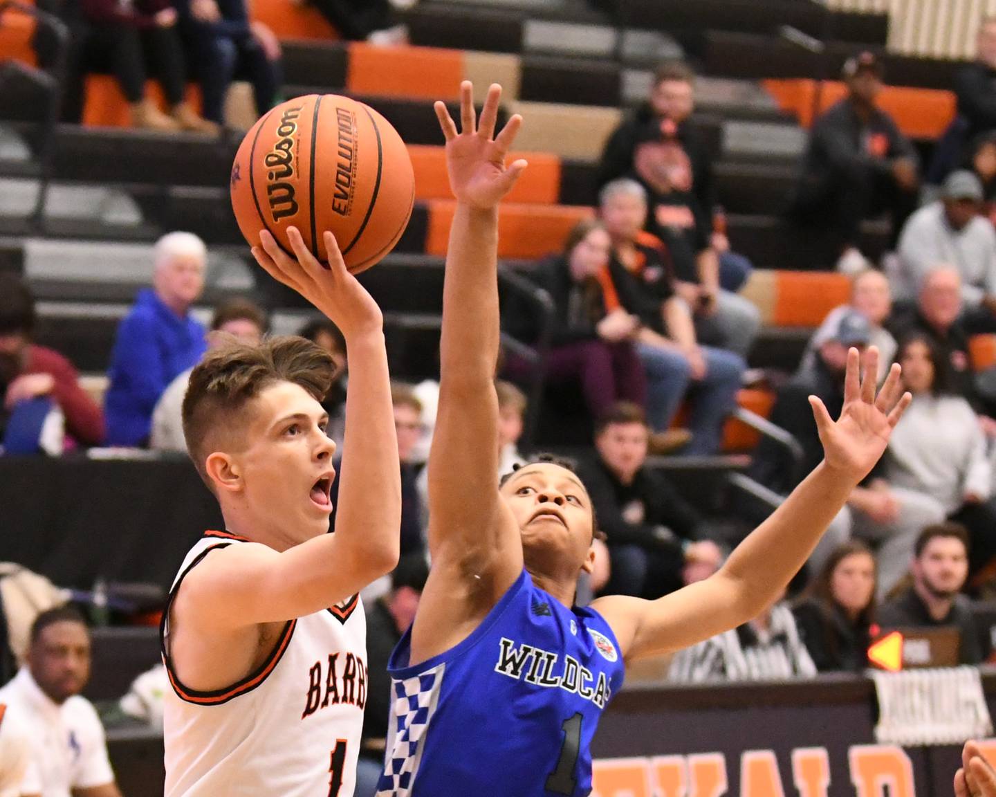 DeKalb's Jackson Kees (1) makes a shot in the first quarter while being defended by Phillips's Amari Edwards (1) on Saturday Dec. 30, 2023, during the championship game of the Dayton Classic held at DeKalb High School.