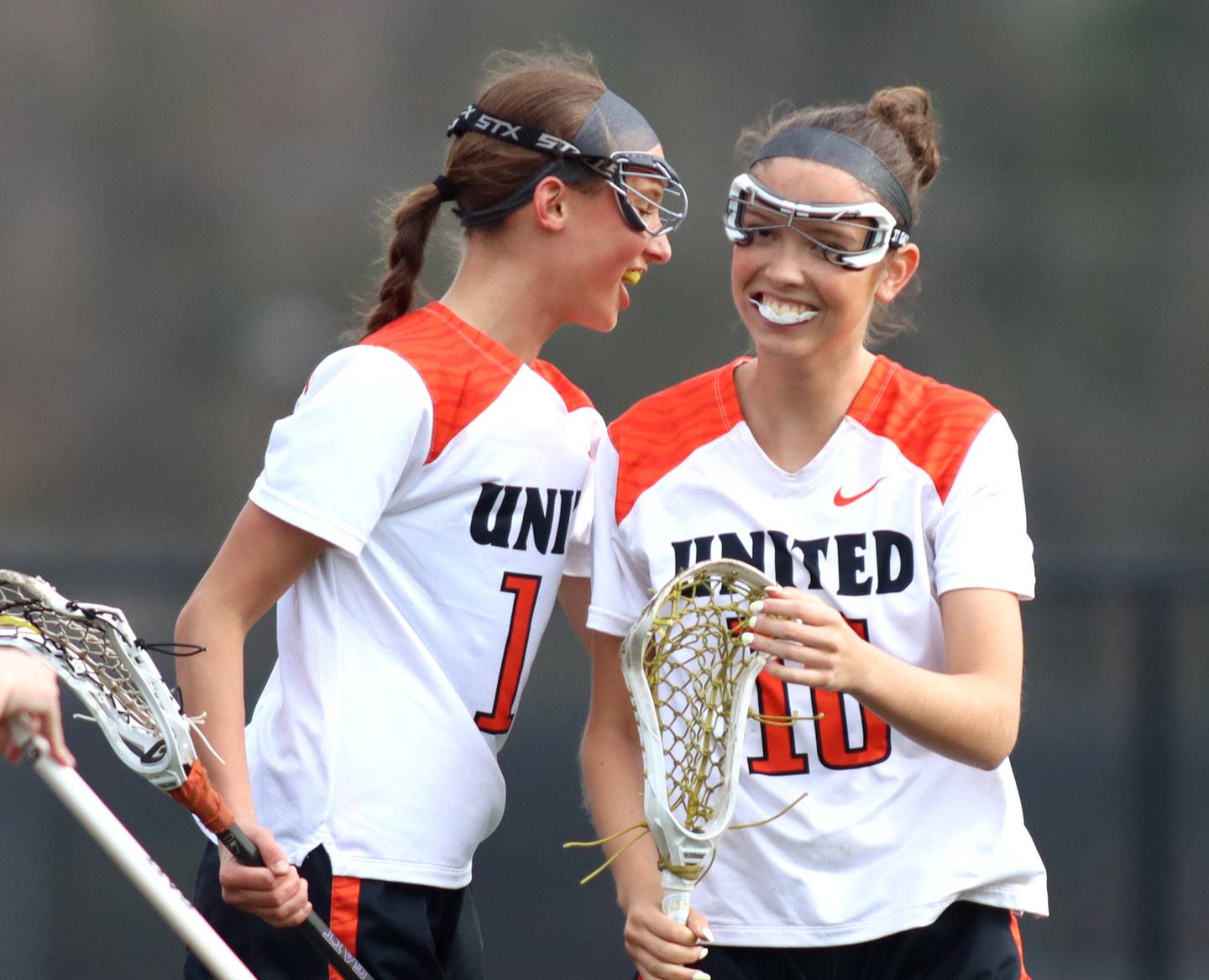 Crystal Lake co-op’s Addie Bechler, left, congratulates teammate Sydney Cruz after a Cruz goal against Huntley in varsity girls lacrosse on Friday, April 18, 2025, at Metcalf Field on the campus of Crystal Lake Central High School in Crystal Lake.