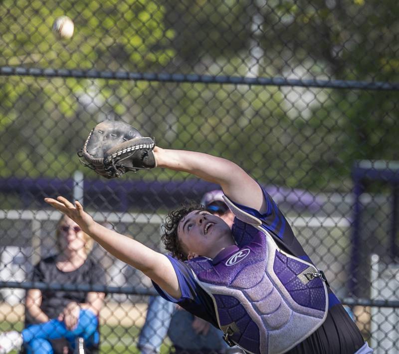 Dixon’s Chase Simpson reaches but can’t come up with a pop-up behind home plate against North Boone Tuesday, May 6, 2025.