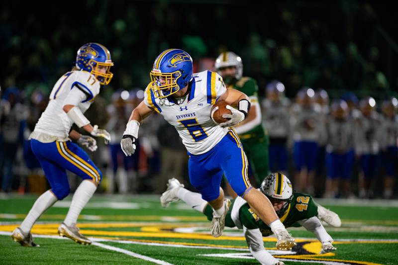 Joh nsburg's Brett Centnarowicz avoids the Coal City defense during the first round IHSA class 4A playoffs on Friday Nov. 1, 2024 at Coal City High School