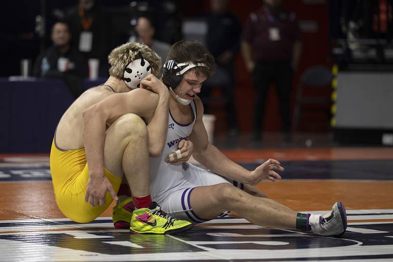 Wilmington’s Logan VanDuyne is controlled by Lena-Winslow’s Eli Larson in the 1A 190 pound class  Saturday, Feb. 21, 2026, at the IHSA wrestling finals in Champaign.