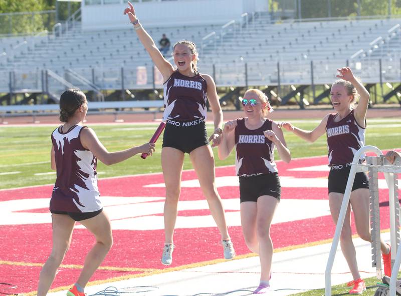 Members of the Morris 4x800 relay team (from left) Leah Ortiz, Paityn Valentine, Makensi Martin and Aubrey Lines celebreate after winning the event during the Interstate 8 Conference girls track championship on Friday, May 9, 2025 at Morris High School.