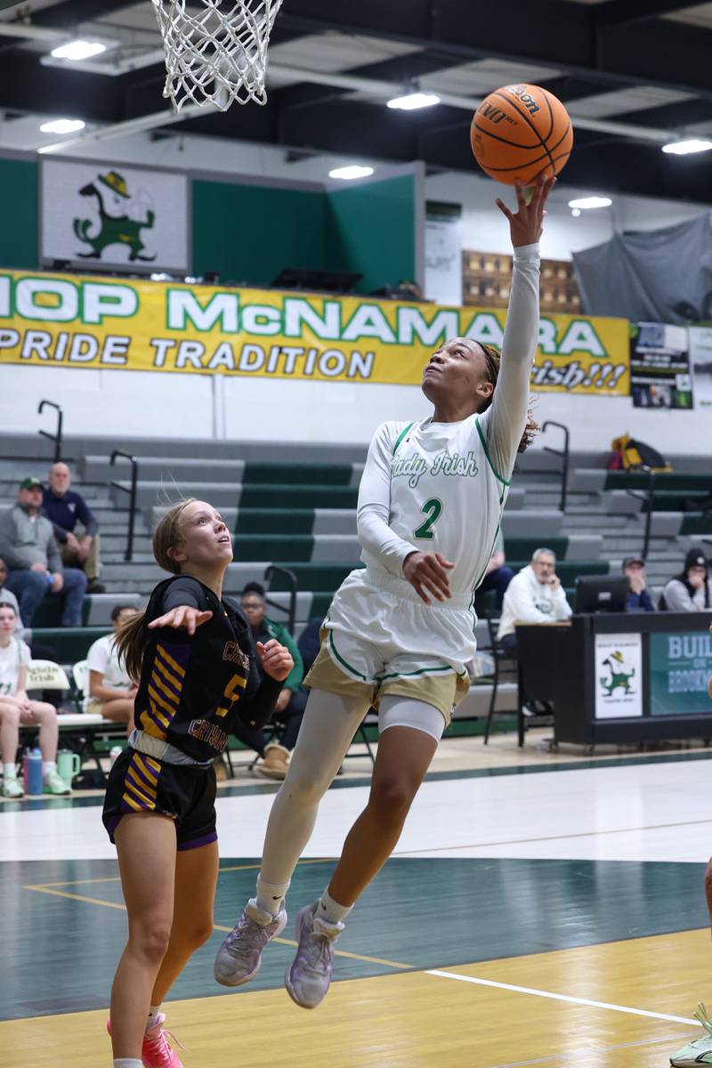 Bishop McNamara's Hailey Jackson tosses up a layup during the Fightin' Irish's 67-27 victory over Chicago Christian on Monday, Jan. 26, 2026.