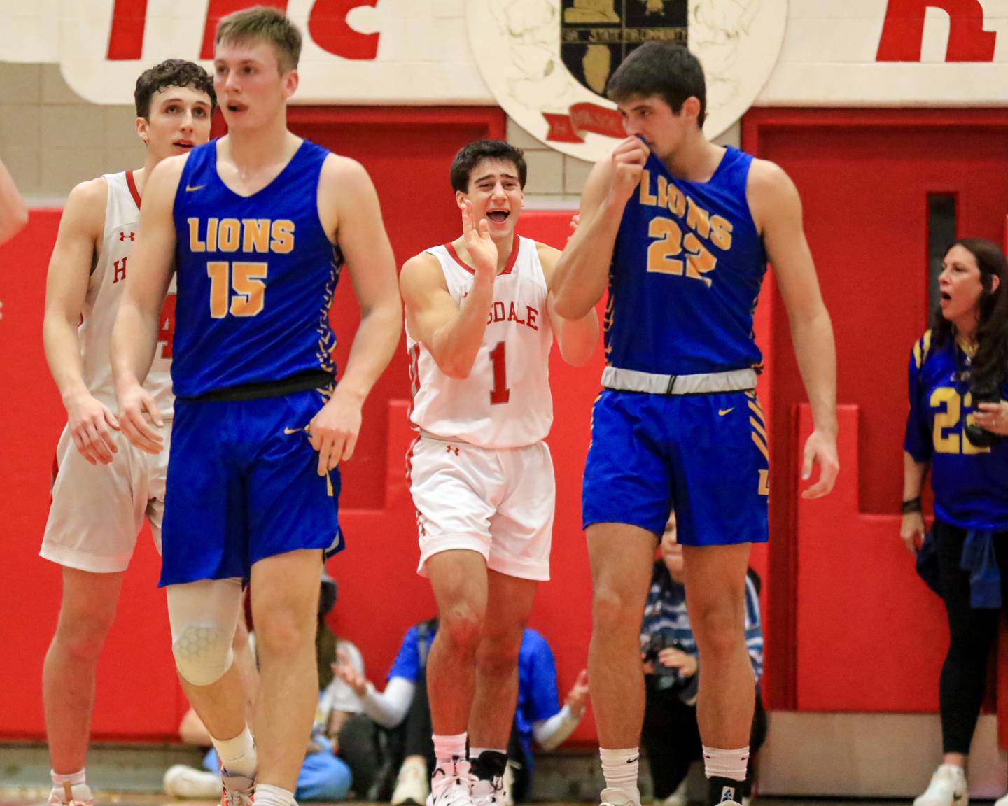 Hinsdale Central's Evan Phillips (1) celebrates a defensive stop during varsity basketball game between Lyons at Hinsdale Central.  Jan 20, 2023.