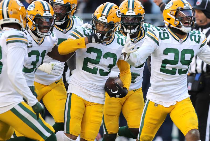 The Green Bay Packers defense celebrates an interception by cornerback Jaire Alexander during their game against the Chicago Bears Sunday, Dec. 4, 2022, at Soldier Field in Chicago.