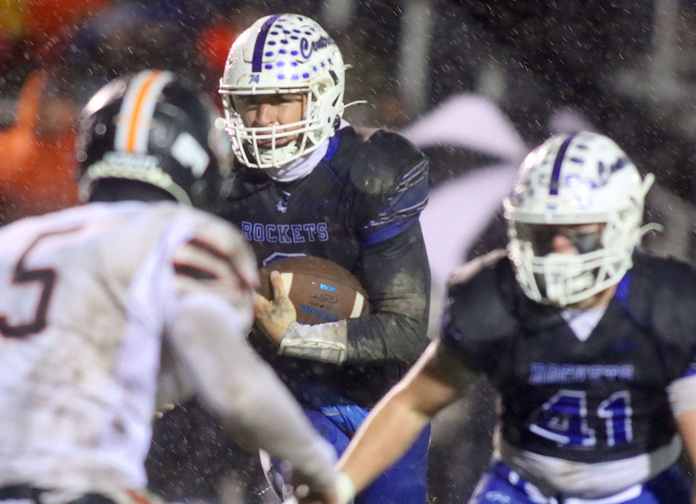 Burlington Central’s Landon Arnold moves the ball against Harlem in IHSA football Class 6A second-round playoff action at Central High School in Burlington on Saturday, November 8, 2025.