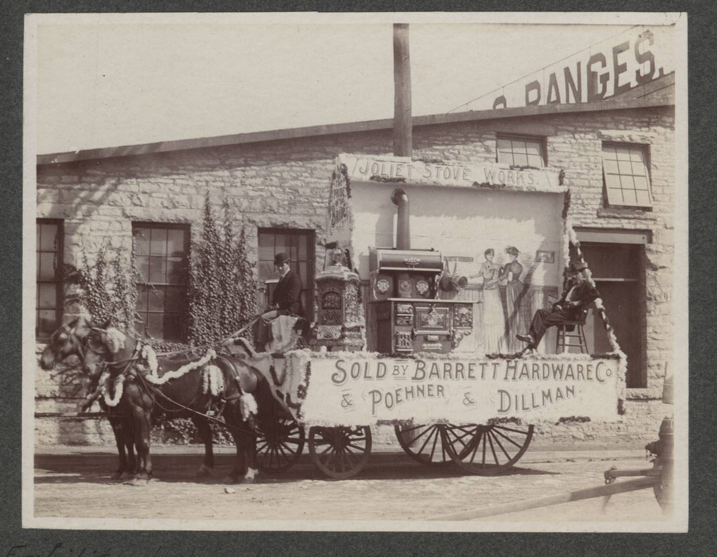 This 1901 parade showcases Joliet's Poehner & Dillman's latest stove, oven and water heater.