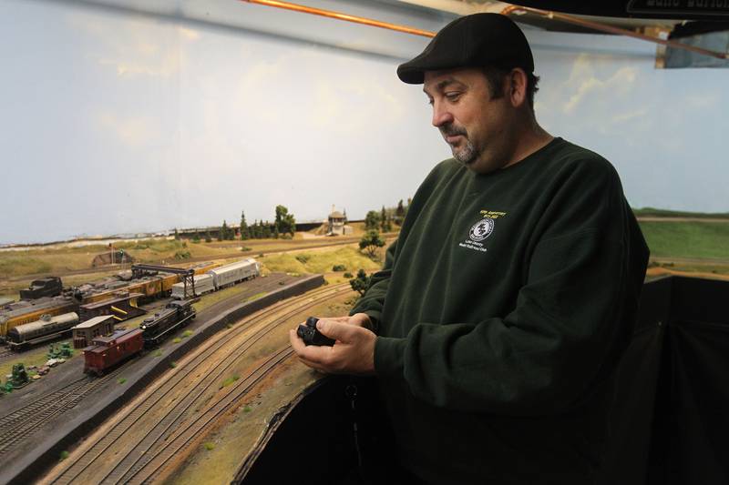 Trent Blasco, of Wauconda controls his steam locomotive freight train on the tracks at the Lake County Model Railroad Club in Wauconda. The club is celebrating their 50th anniversary