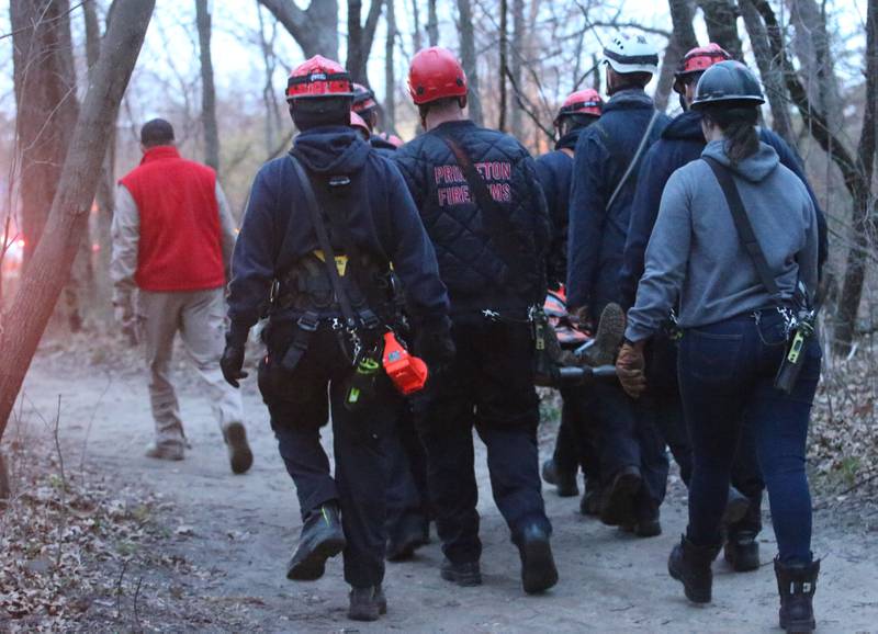 Firefighters carry a patient from French Canyon who fell 20-30 feet on Tuesday, April 1, 2025 at Starved Rock State Park. A Mutual Aid Box Alarm System (MABAS) prompted rope and rescuers as far as Marseilles and Princeton.