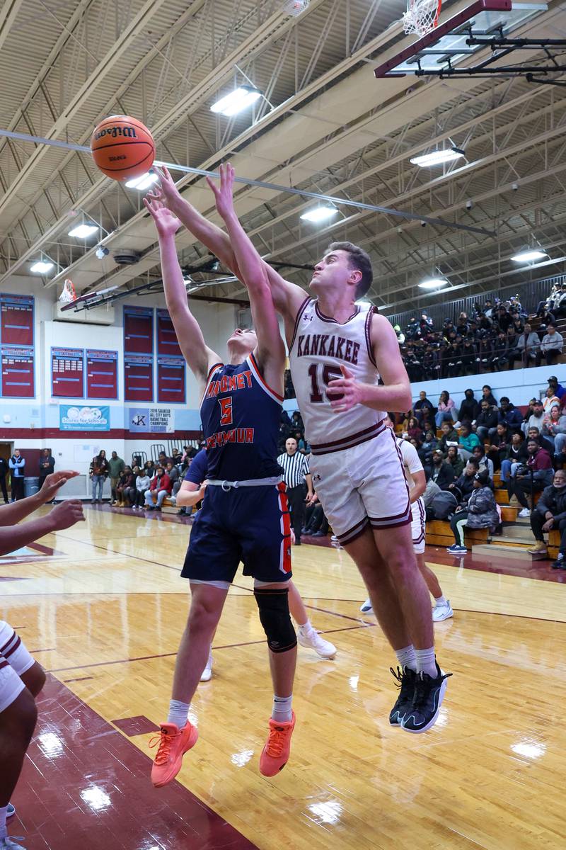 Kankakee's Eli Cunningham tips a rebound to teammate during the Kays' 74-60 victory over Mahomet-Seymour on Tuesday, Dec. 2, 2025.